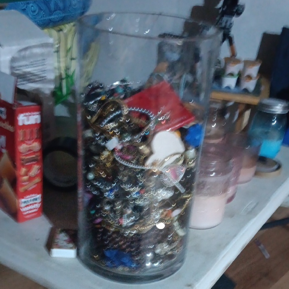 Assorted Jewelry Collection in Glass Vase